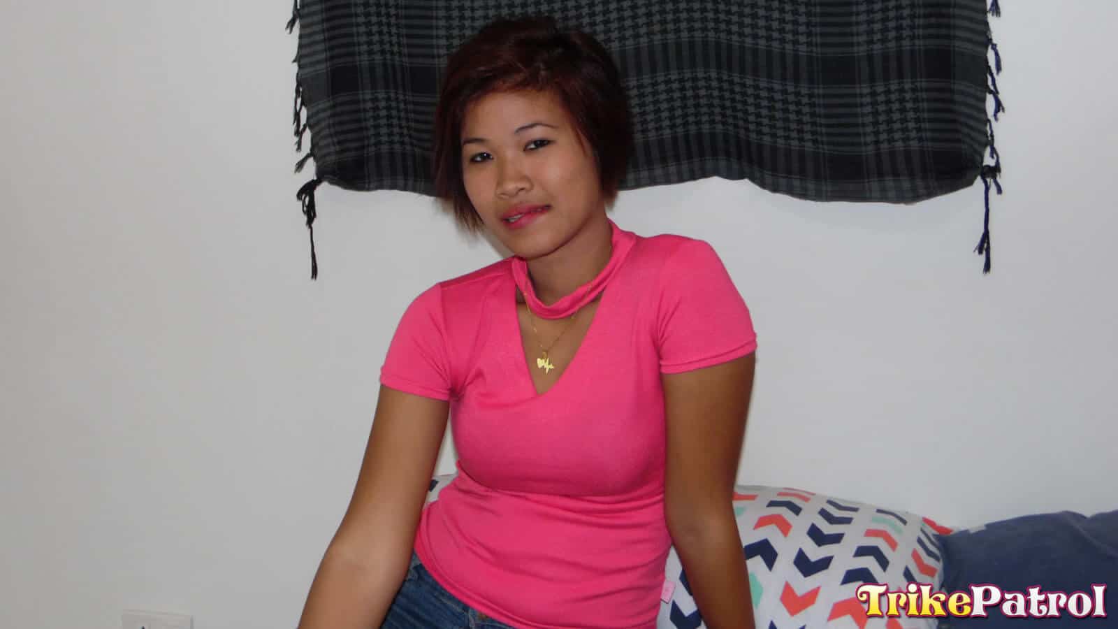 Cute Filipina in pink top on bed