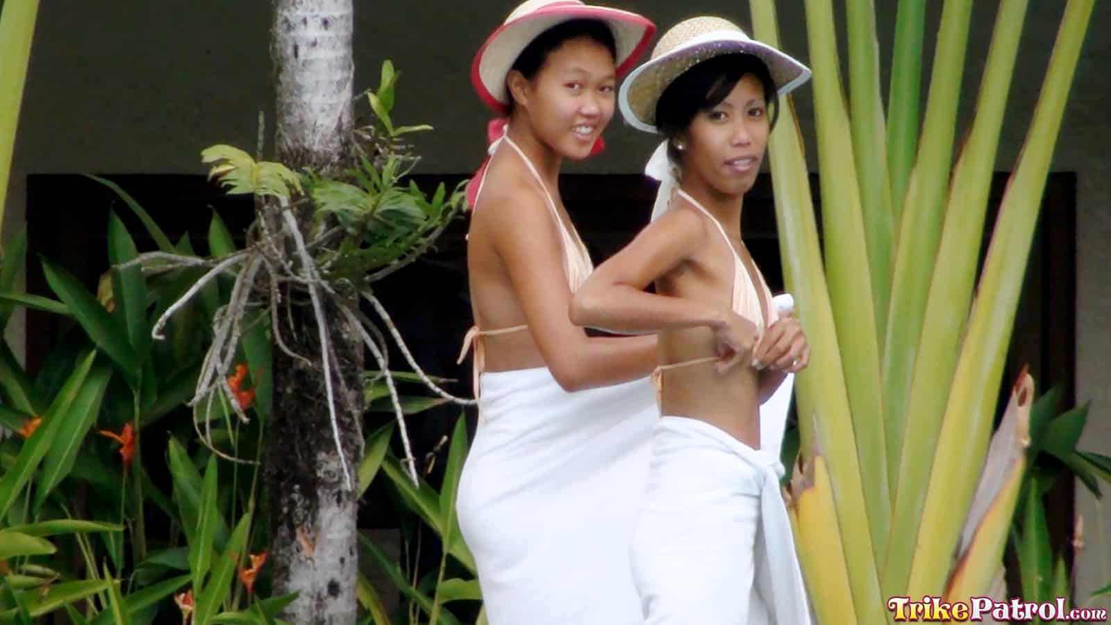 Asian girls being playful at their pool party