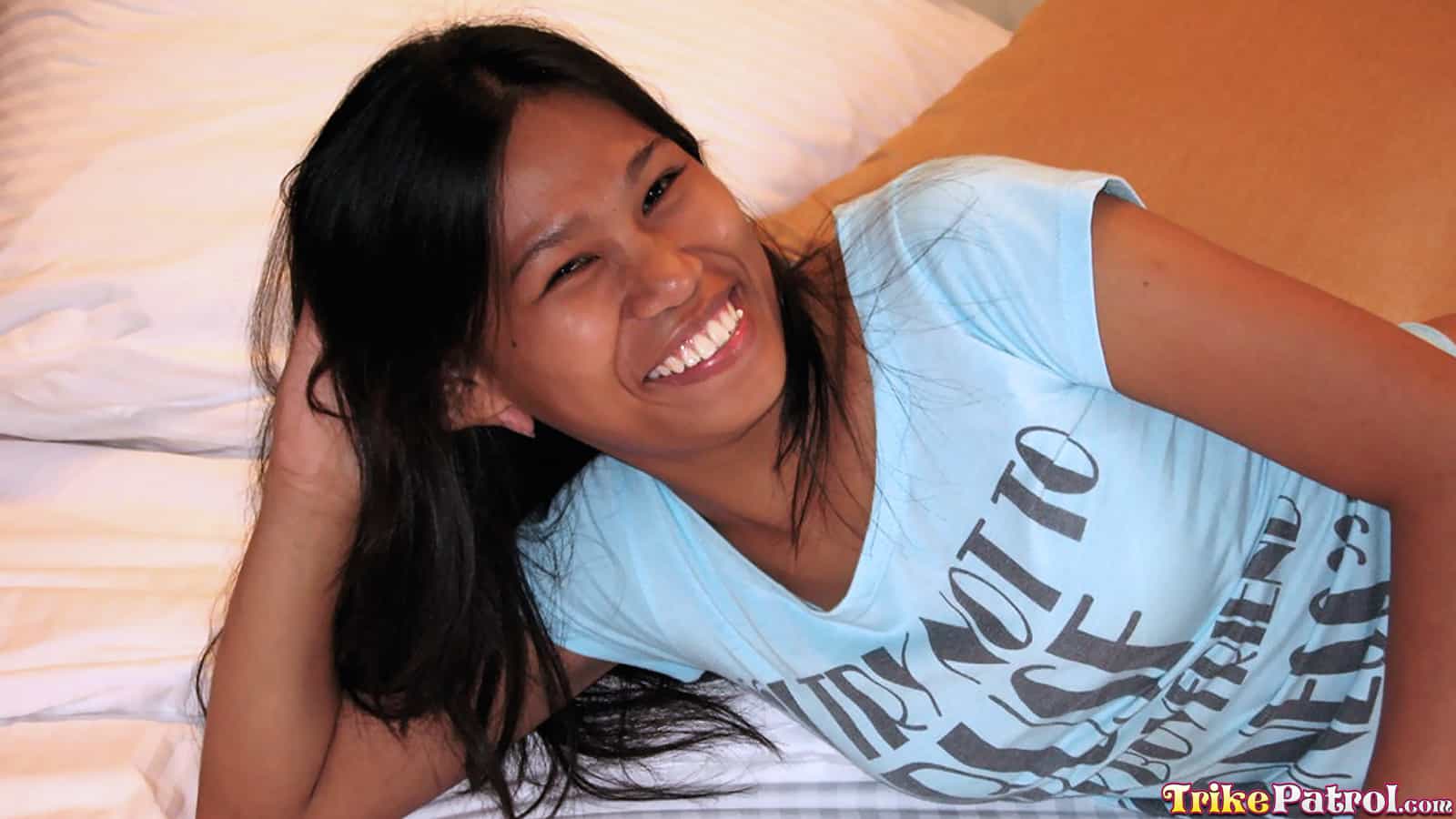 Sexy Asian girl is happy to be modeling for trikepatrol.com