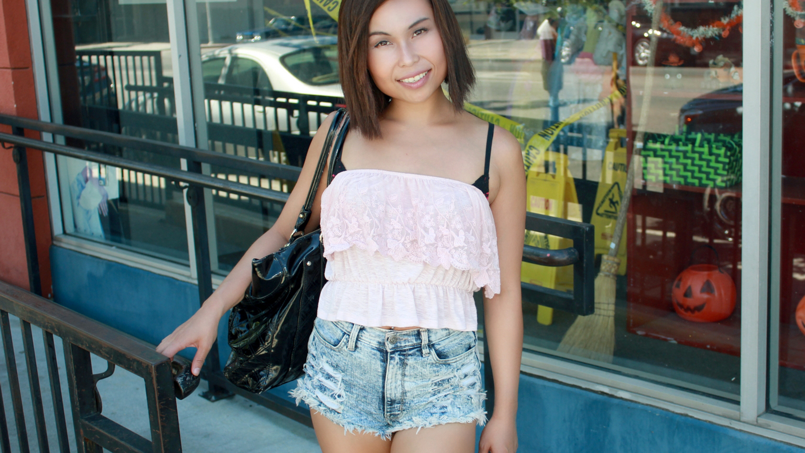 Pretty Asian in the States outside a store