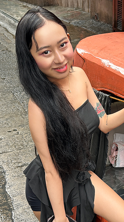 Stunning Pinay Trike Patrol Mina Uy poses next to the infamous Manila trike